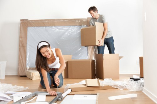 Professional furniture removals team handling a sofa in Surrey