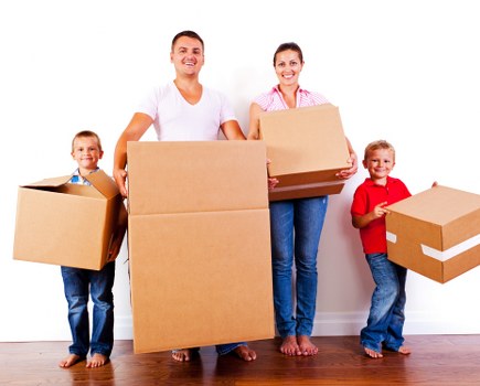 Furniture pick-up service in Surrey removing a large sofa from a home