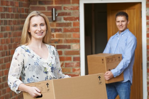 Professional man and van moving items through a Surrey residential street