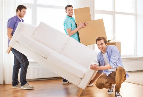 Packed moving boxes ready for flat removals in Surrey