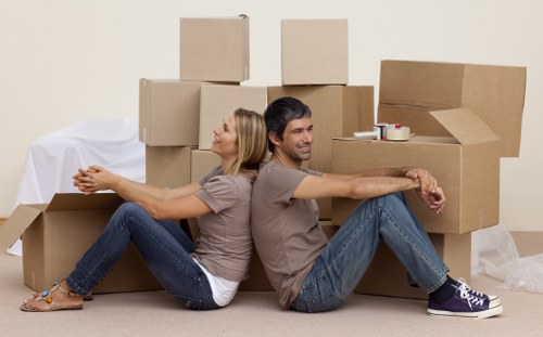 Local moving team handling furniture in a Surrey street