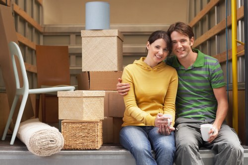 Moving large bedroom furniture through a Surrey home