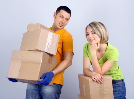 Organised packing boxes and labels for Surrey house moving