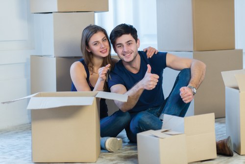 Professional movers handling office equipment during a local relocation