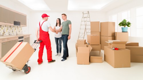 Moving boxes and household items ready for house removal in Surrey