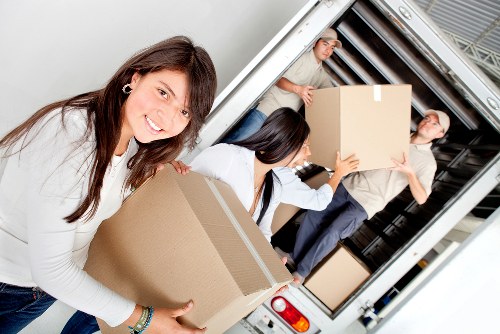 Packed office equipment ready for transport during a Surrey business relocation