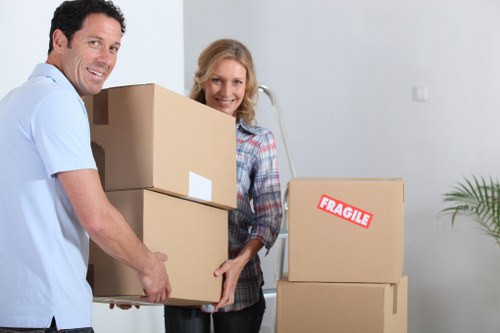 Mover handling boxes and furniture during a transport job
