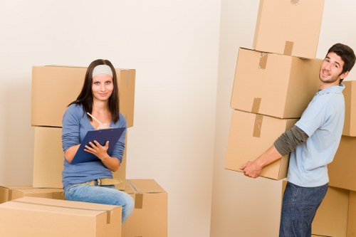 Furniture being carried through a flat staircase during a Surrey removal