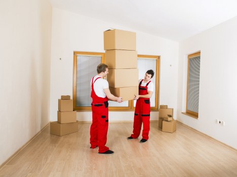 Professional moving van service loading boxes in Surrey