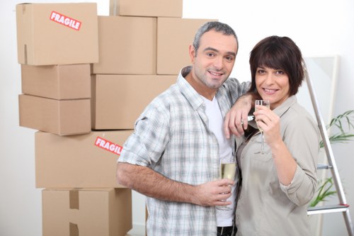 Packed office equipment prepared for relocation in Surrey